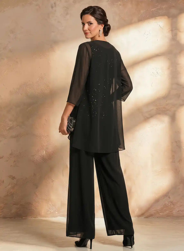 Back view of a black chiffon jacket pantsuit with an elegant flowing silhouette