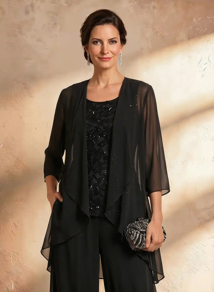 Black evening pant suit featuring elegant fabric details and a sophisticated design