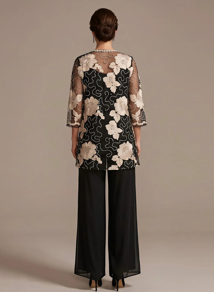 Back view of a black pant suit featuring an elegant floral lace jacket for formal occasions