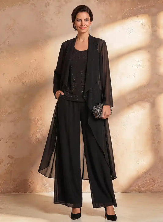 Sophisticated black special occasion pantsuit with embellished top and flowing chiffon layer