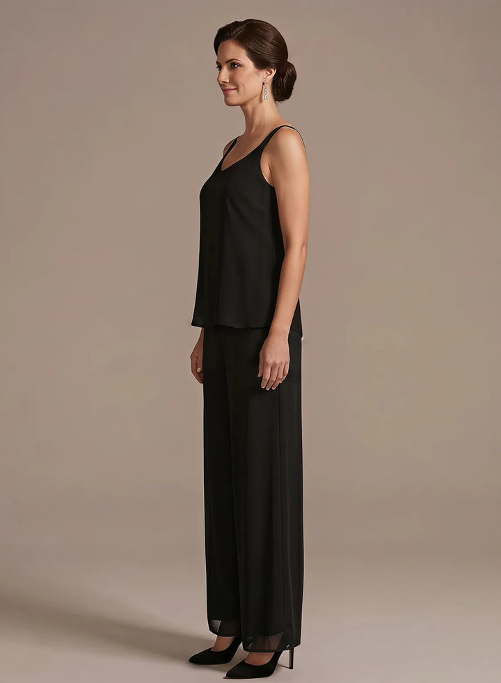 Black mother of the bride pantsuit with an embroidered lace overlay and elegant fit