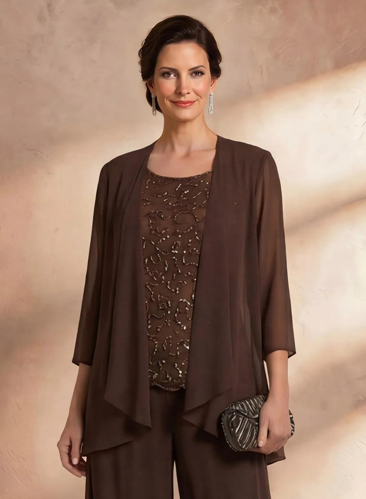 Close up of brown beaded lace formal top with elegant embroidery details