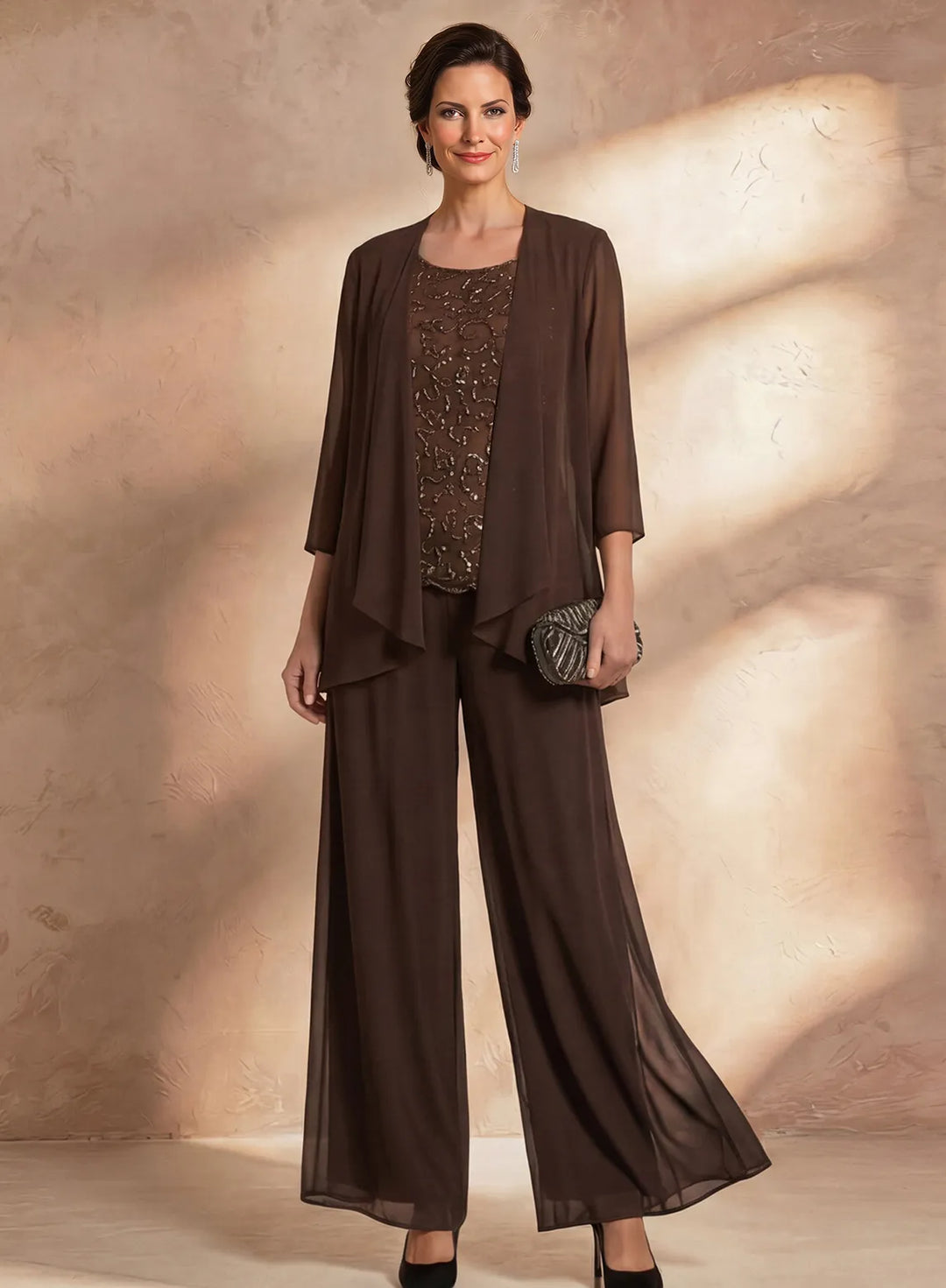 Brown mother of the bride pantsuit with beaded lace top, matching jacket and wide leg formal pants