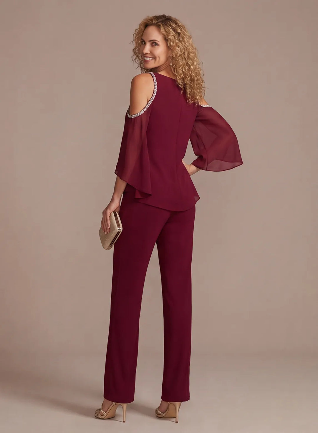 Back of elegant burgundy chiffon pantsuit with flowing overlay top