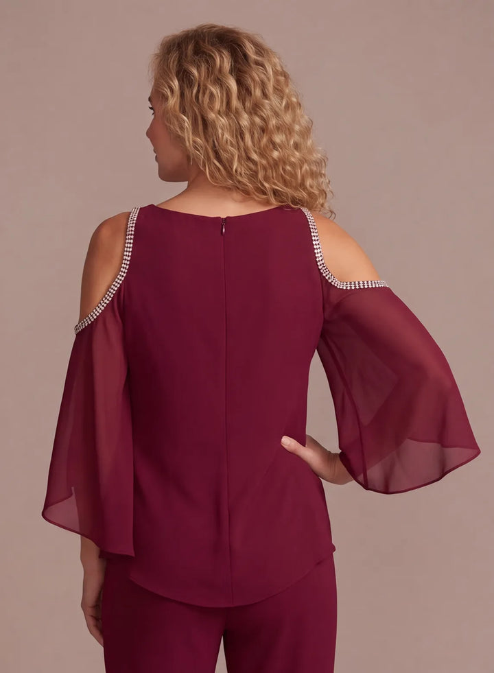 Back view of burgundy cold shoulder pantsuit with layered chiffon sleeves