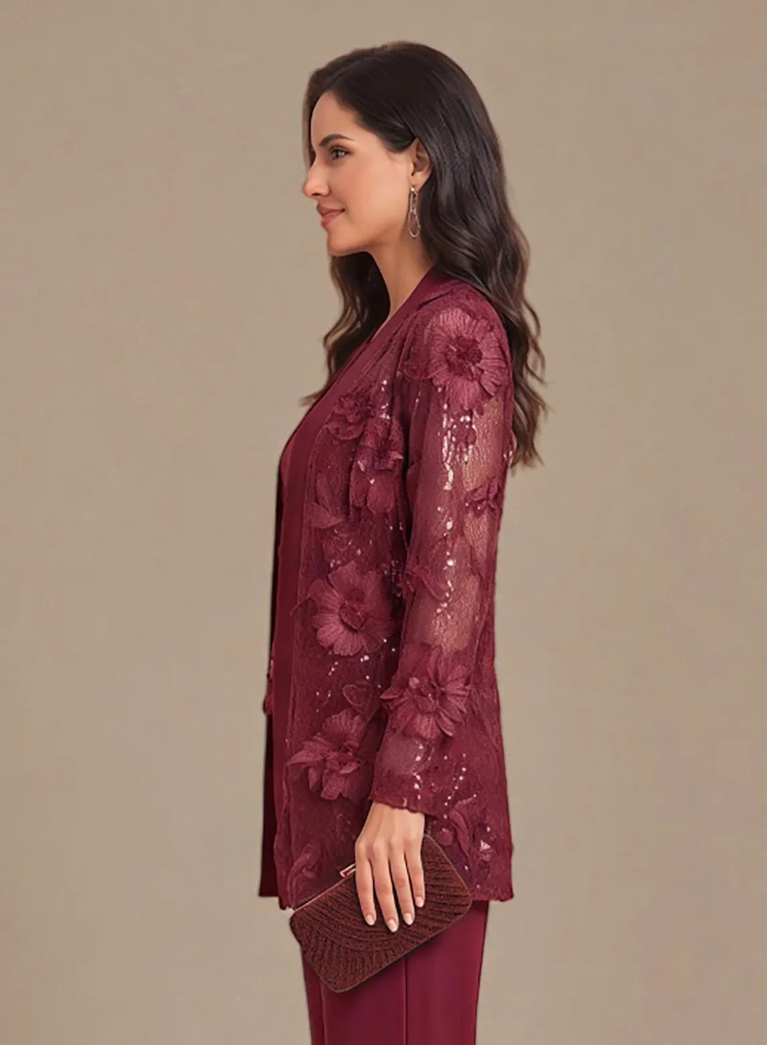 Burgundy mother of the bride pant suit with embellished details and a sophisticated silhouette