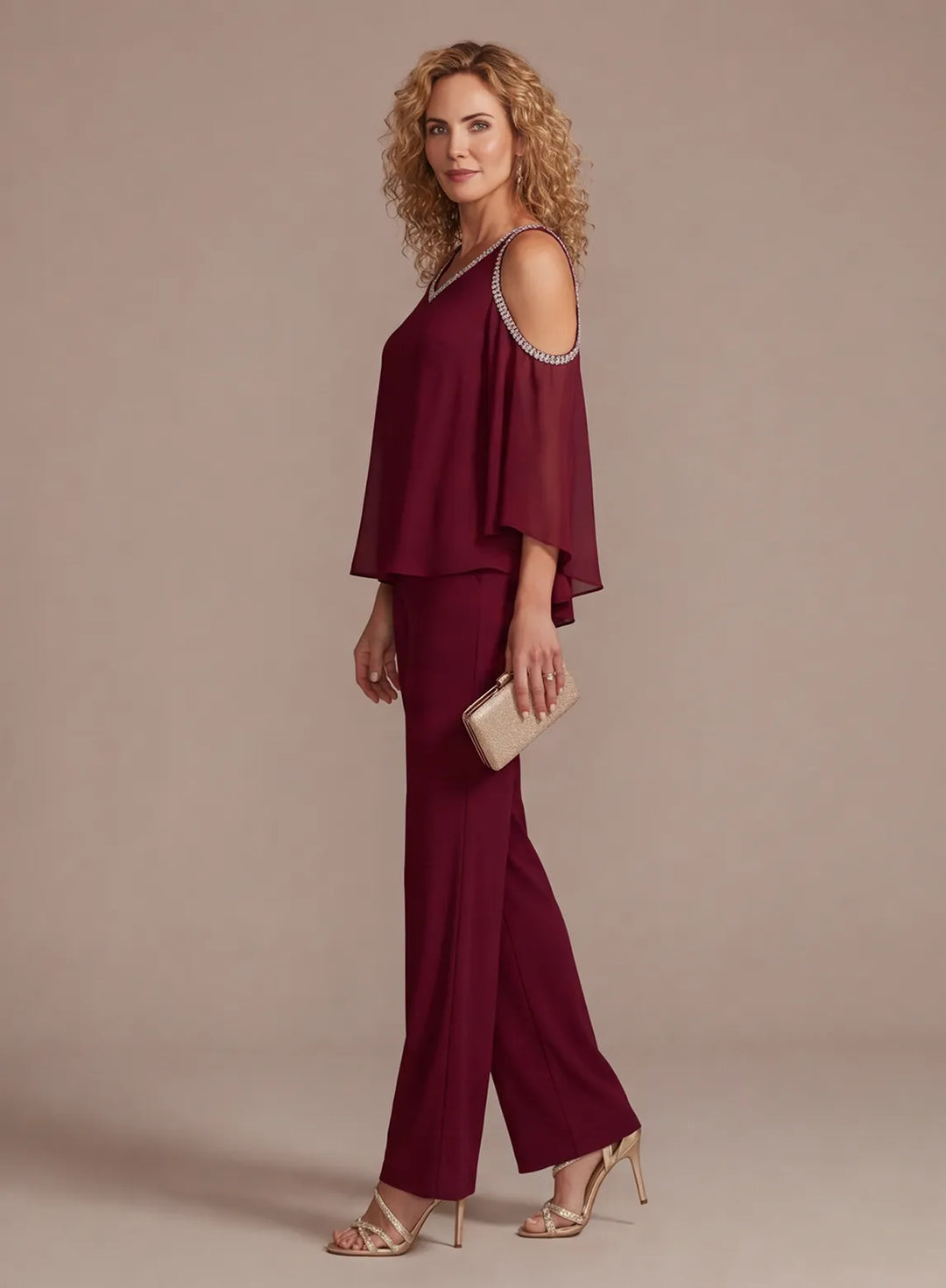 Side view of burgundy two piece formal pantsuit with straight leg trousers