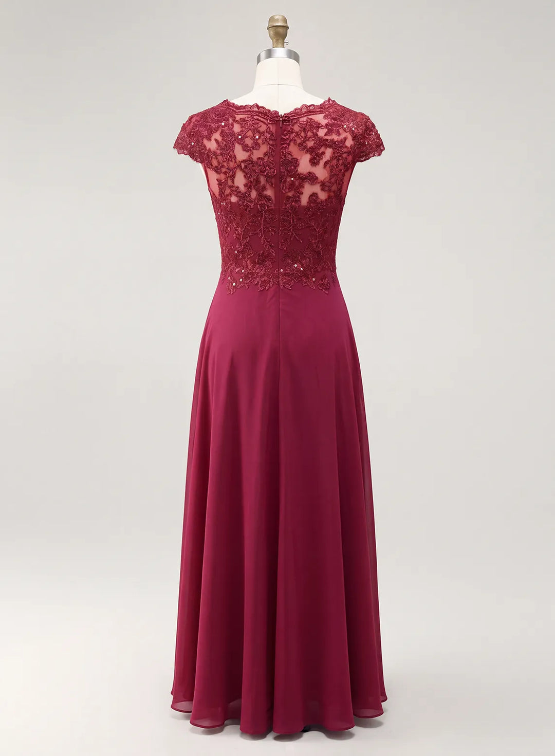 Burgundy formal gown with an intricate lace back and fitted waist for an elegant seasonal wedding
