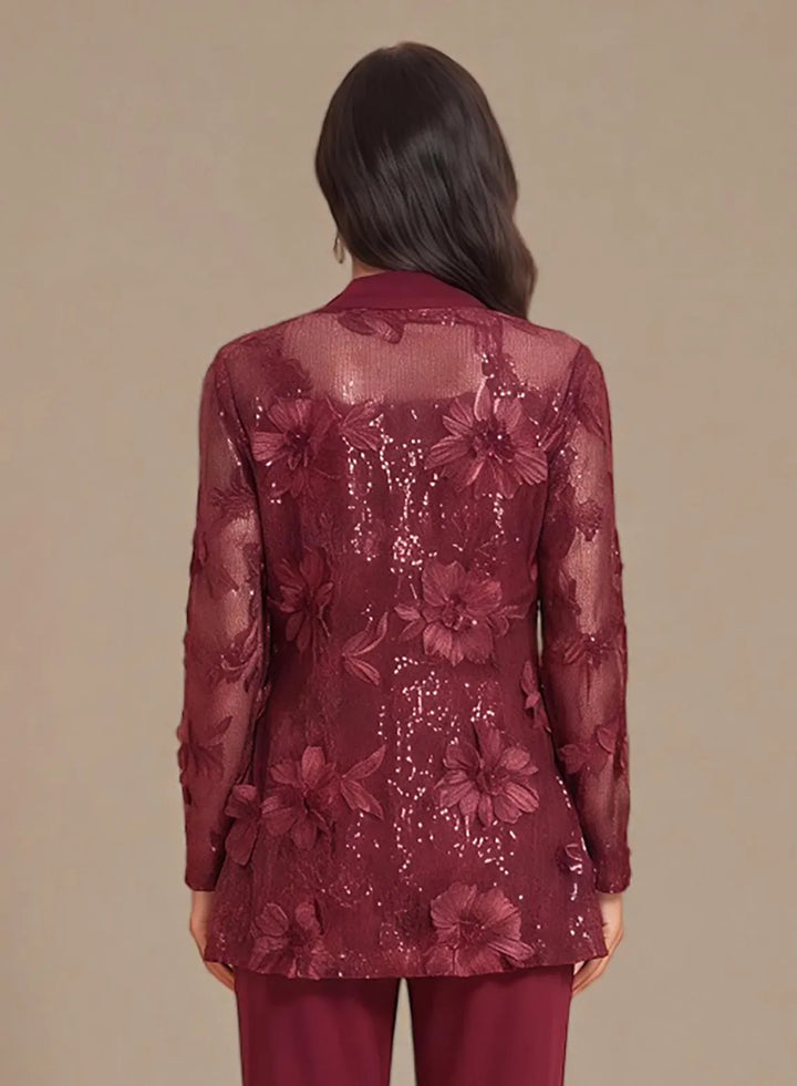 Burgundy evening outfit with a flowing lace jacket and elegant formal design