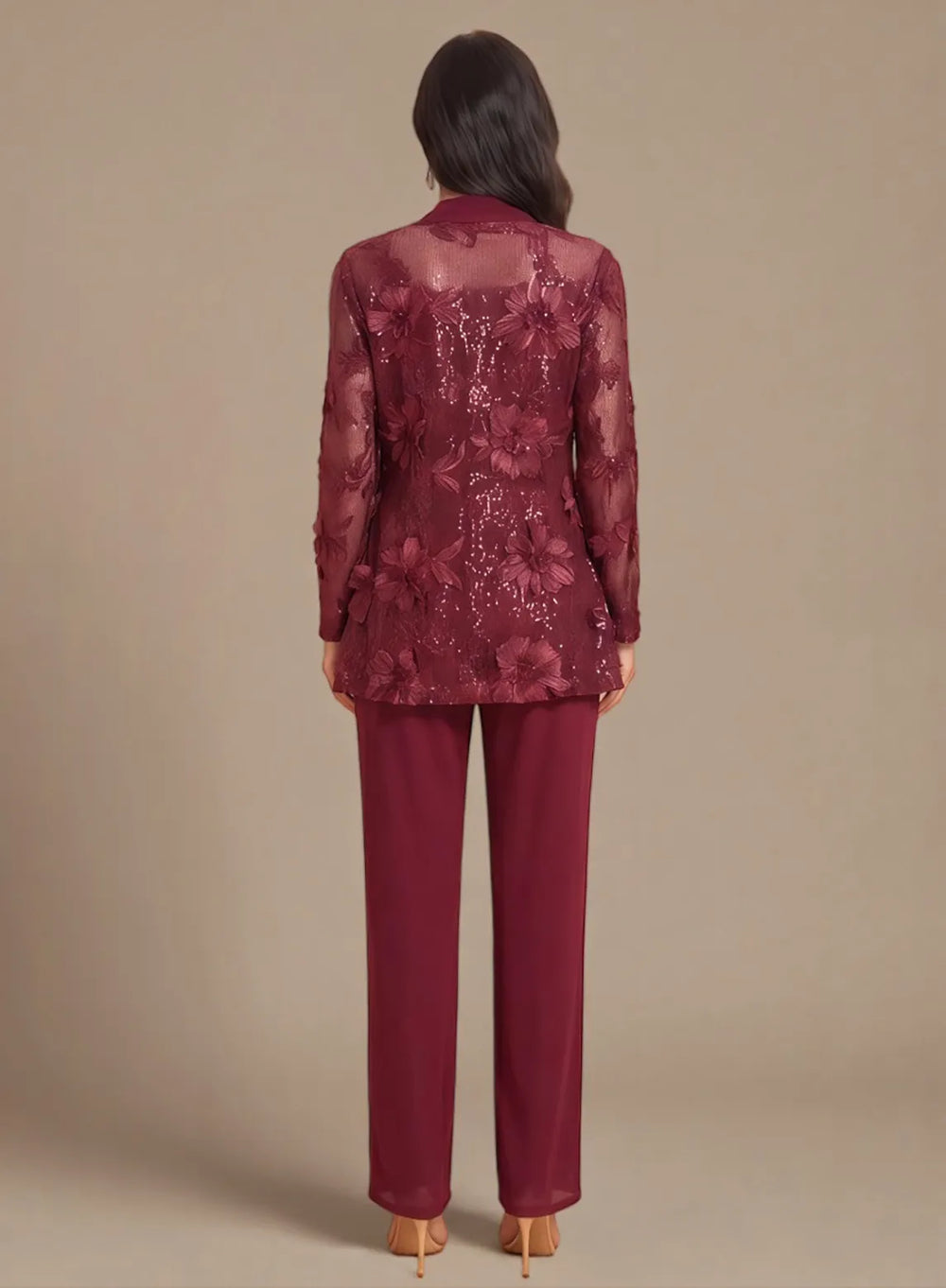 Back view of a burgundy formal pantsuit featuring an elegant lace overlay jacket