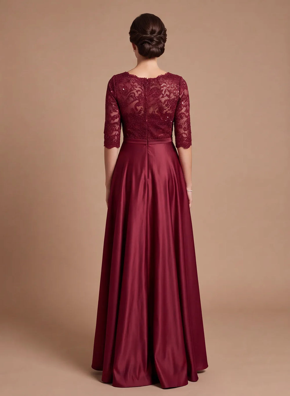 Back view of burgundy lace and satin mother of the bride dress with lace sleeves and a floor-length skirt
