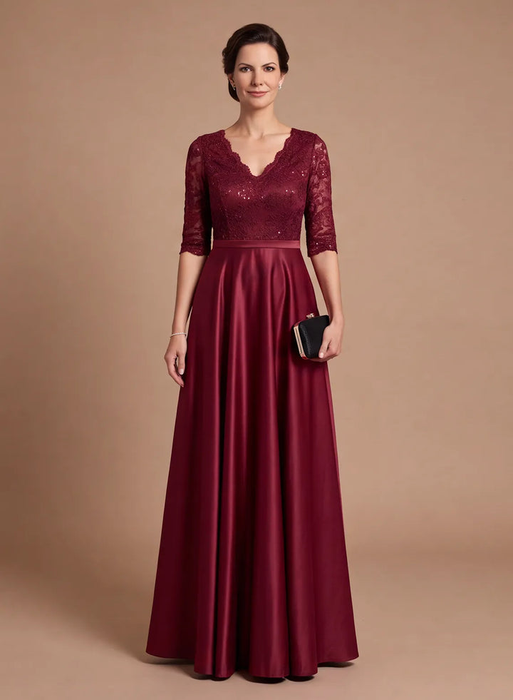 Burgundy lace mother of the bride dress with 3/4 sleeves and a flowing satin A-line skirt, front view