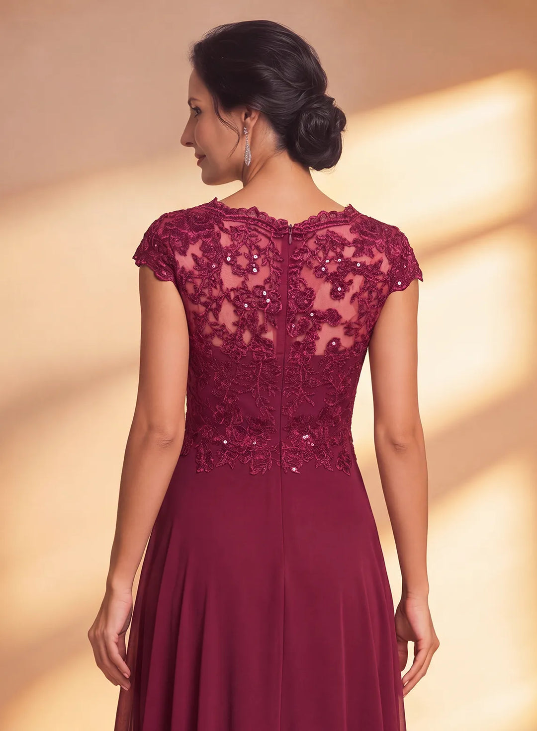 Burgundy long formal dress back view featuring lace and sequin details with an elegant floor length silhouette