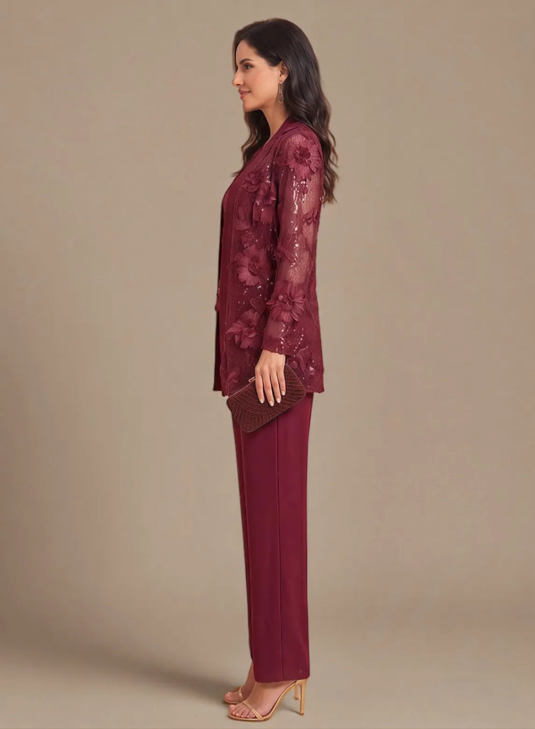 Burgundy mother of the bride pant suit with embellished details and a sophisticated silhouette