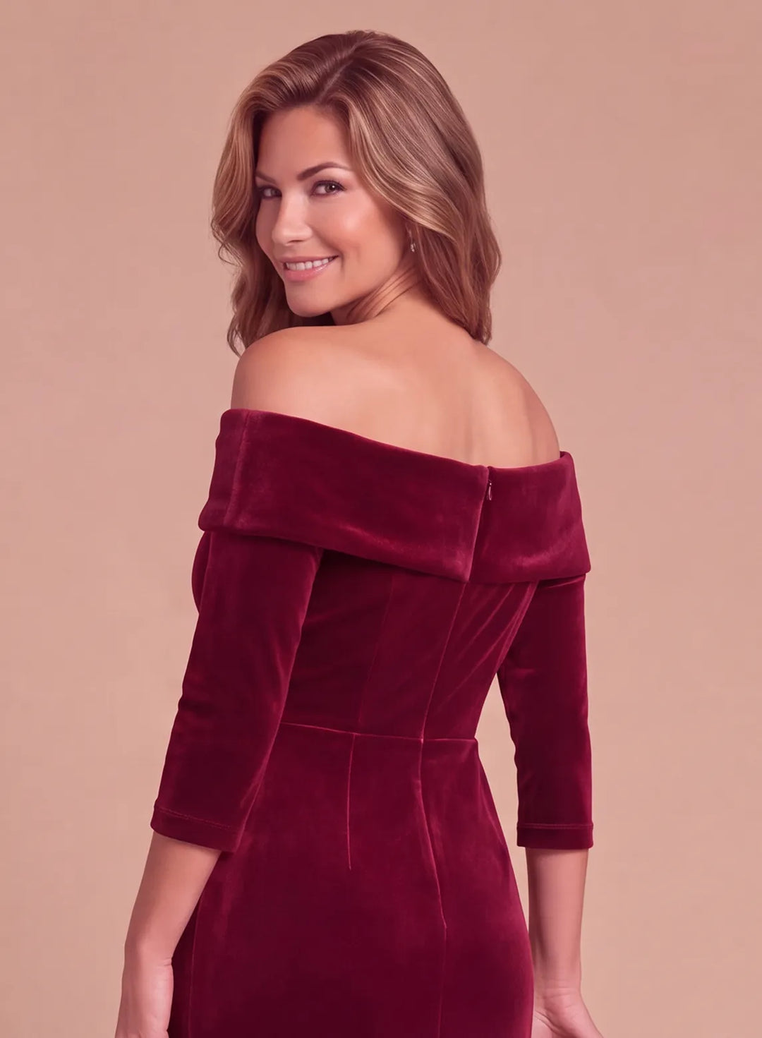 Back bodice detail of a burgundy velvet off-the-shoulder evening gown with a folded neckline and fitted waist.