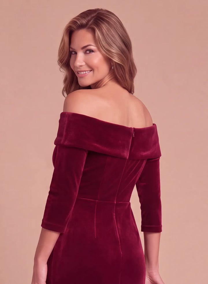 Back bodice detail of a burgundy velvet off-the-shoulder evening gown with a folded neckline and fitted waist.