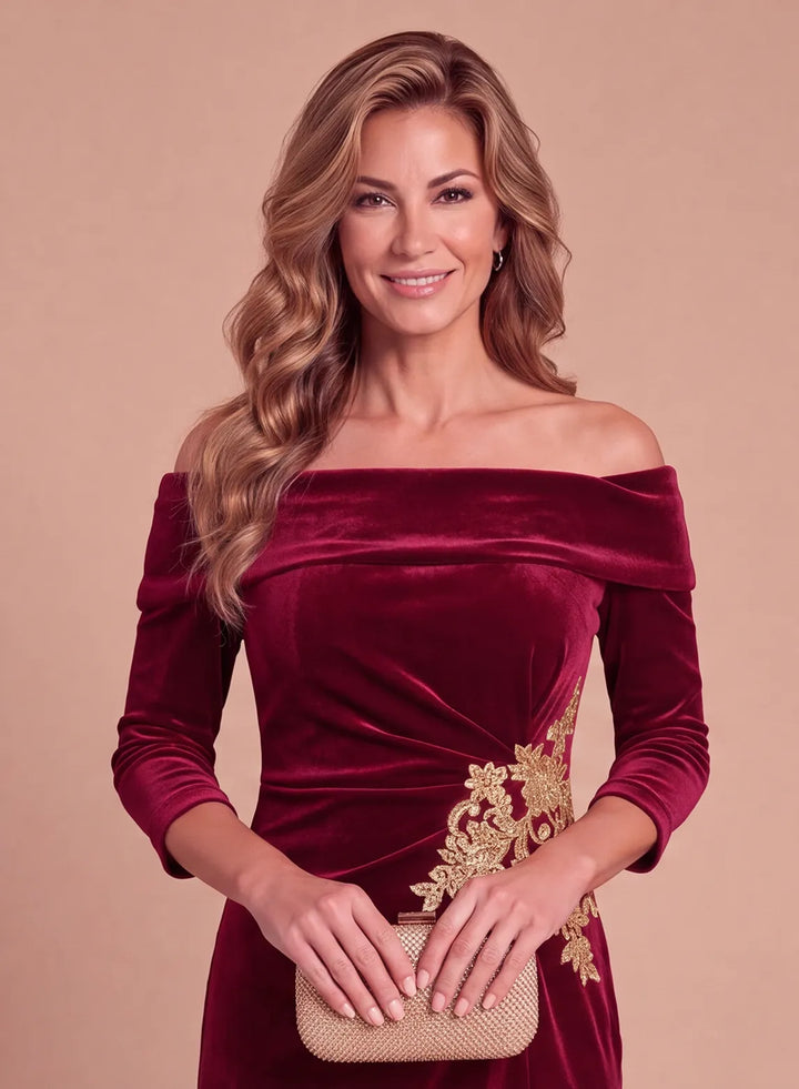 Burgundy velvet off-the-shoulder gown with gold floral appliqué, front bodice detail.