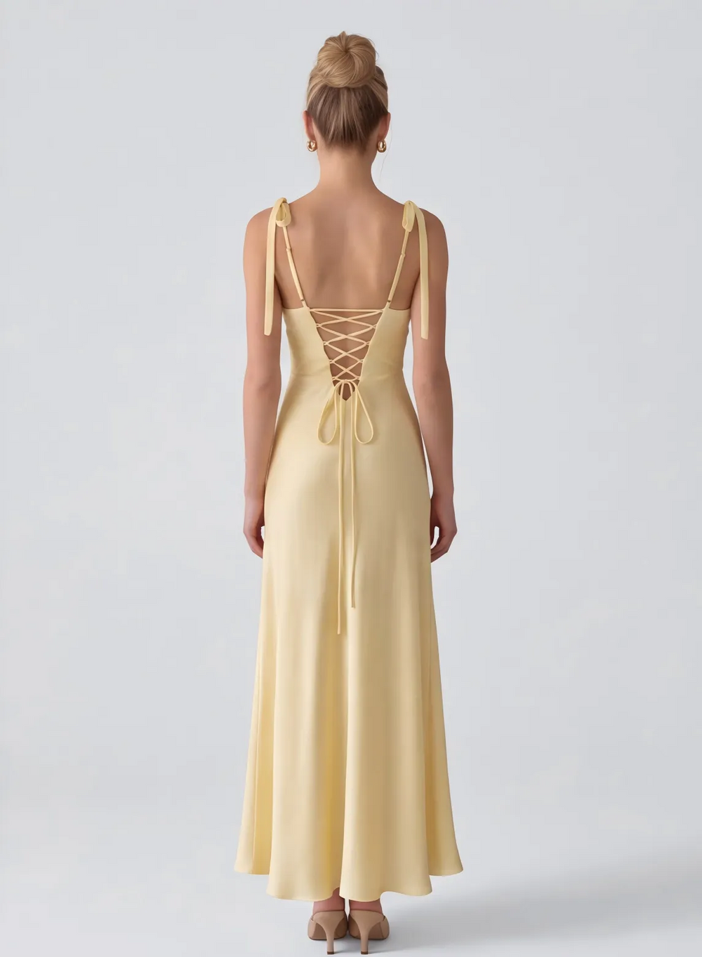 Butter yellow evening dress with elegant back detail and floor length A-line skirt