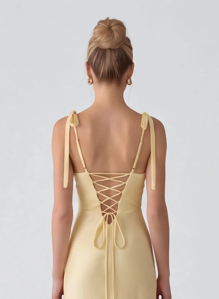 Butter yellow formal gown with beautiful back design and elegant finishing details