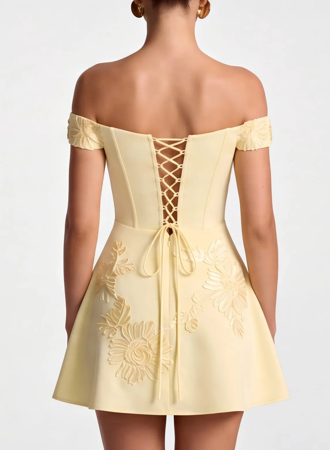 Back detail of champagne homecoming dress with corset style lace up design