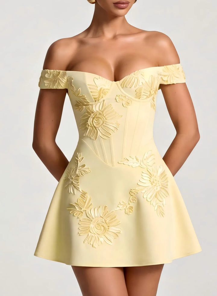 Close up detail of champagne short homecoming dress with elegant fabric and neckline