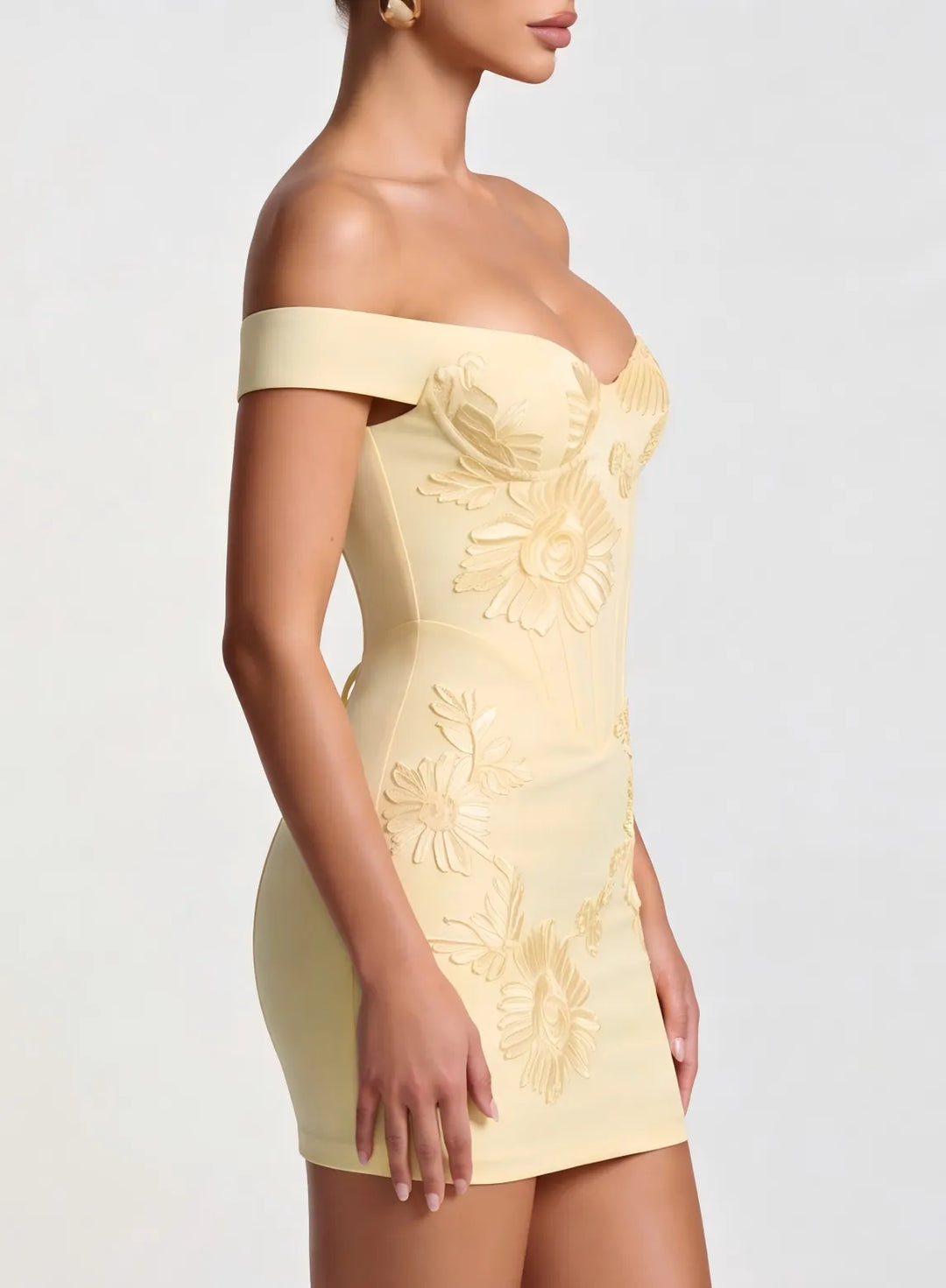 Close up detail of champagne lace homecoming dress with an elegant off shoulder neckline