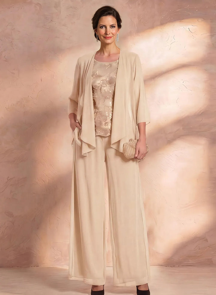 Champagne mother of the bride pantsuit with matching chiffon jacket and elegant lace top, formal wedding outfit