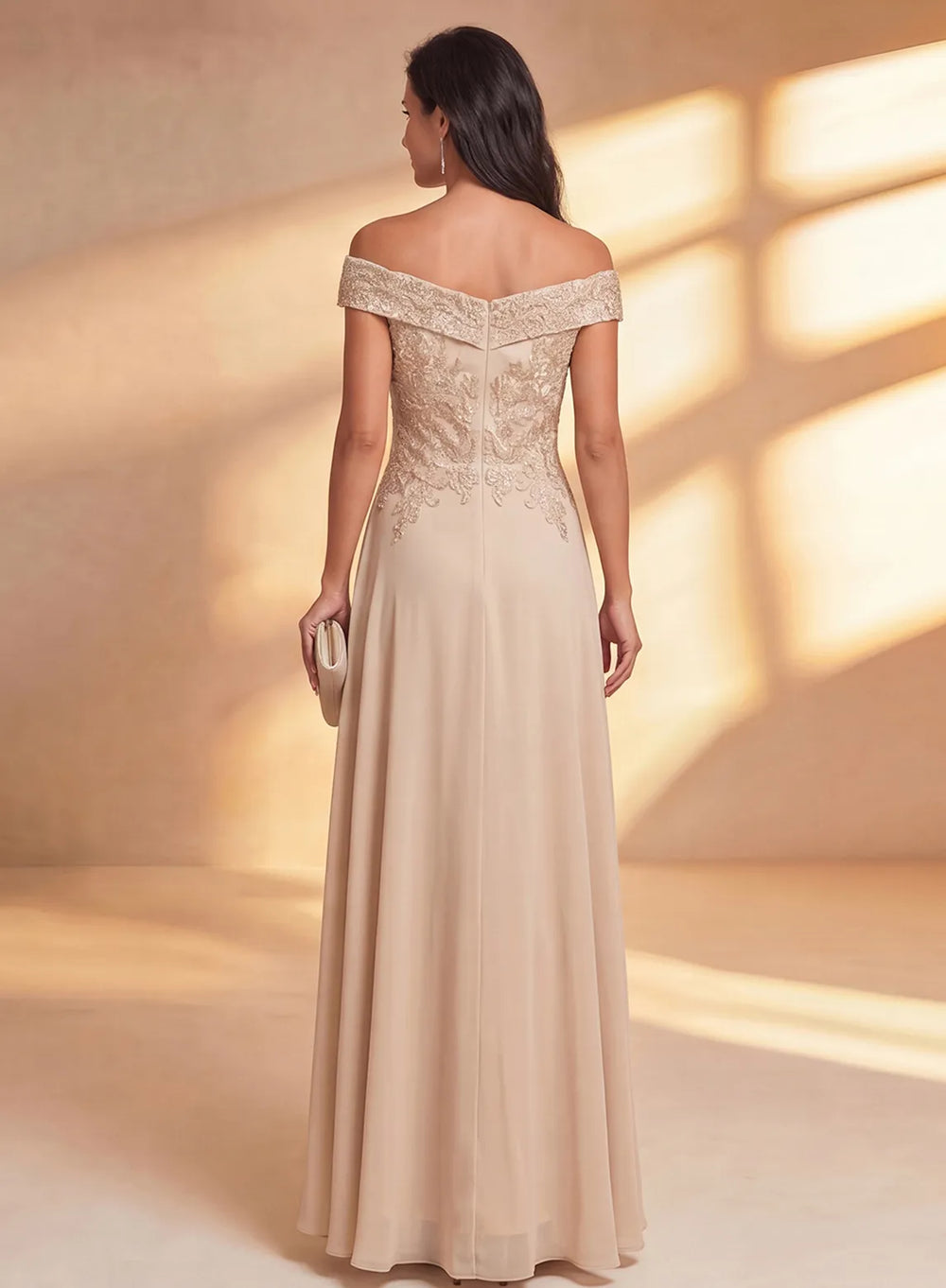 Back view of elegant champagne mother of the bride chiffon dress with lace detailing