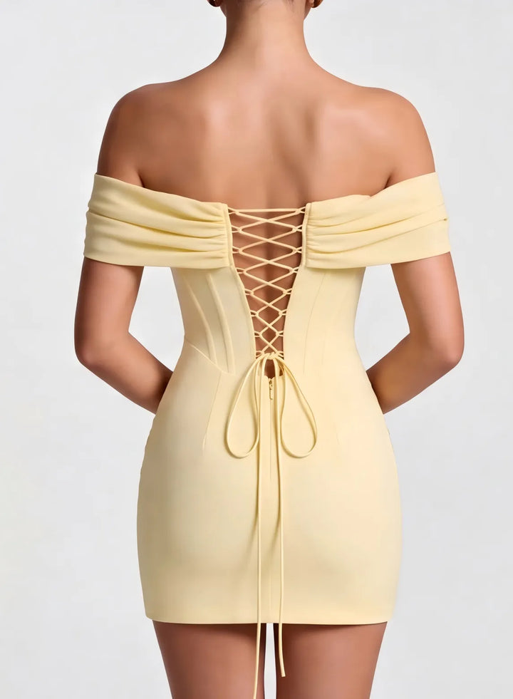 Cream corset back dress with adjustable lace-up detail and elegant back design