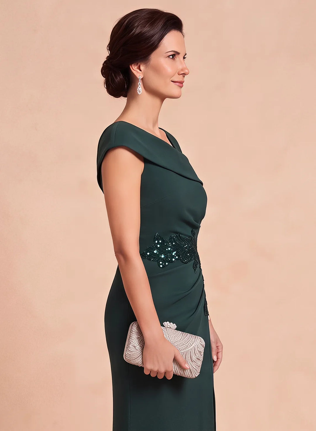 Side upper-body view of a dark green evening gown featuring a fitted bodice and sparkling waist detail