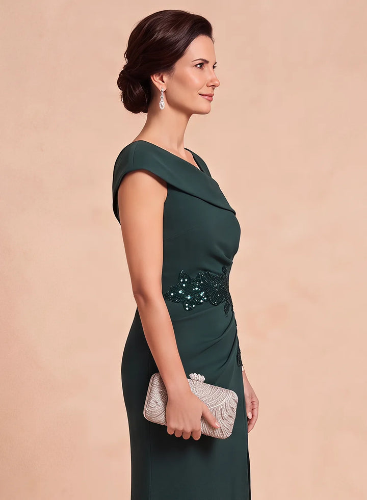 Side upper-body view of a dark green evening gown featuring a fitted bodice and sparkling waist detail