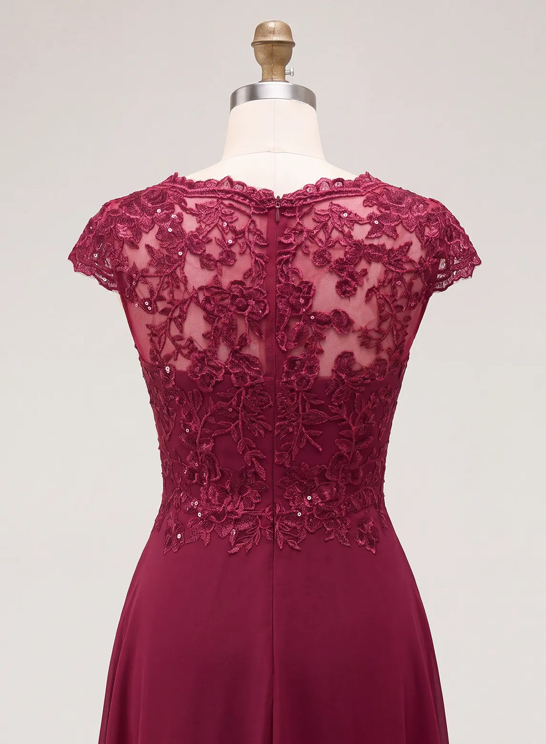 Dark red lace gown with a detailed back and flowing skirt for a winter wedding