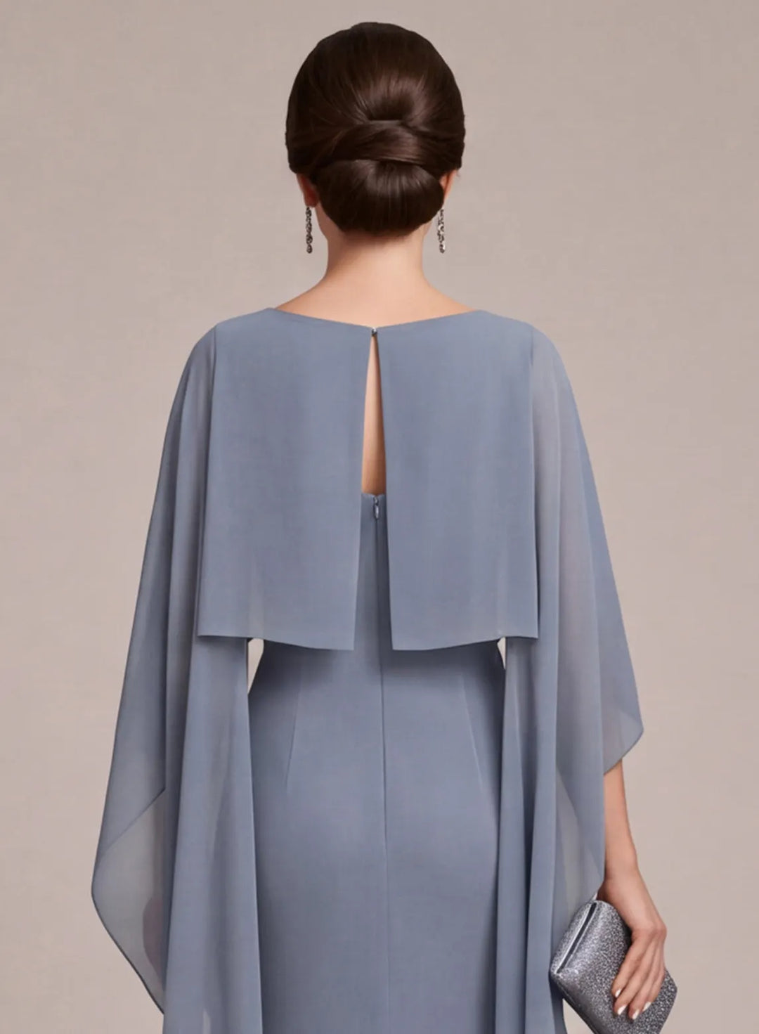 Back detail of dusty blue mother of the bride dress with elegant cape sleeve design