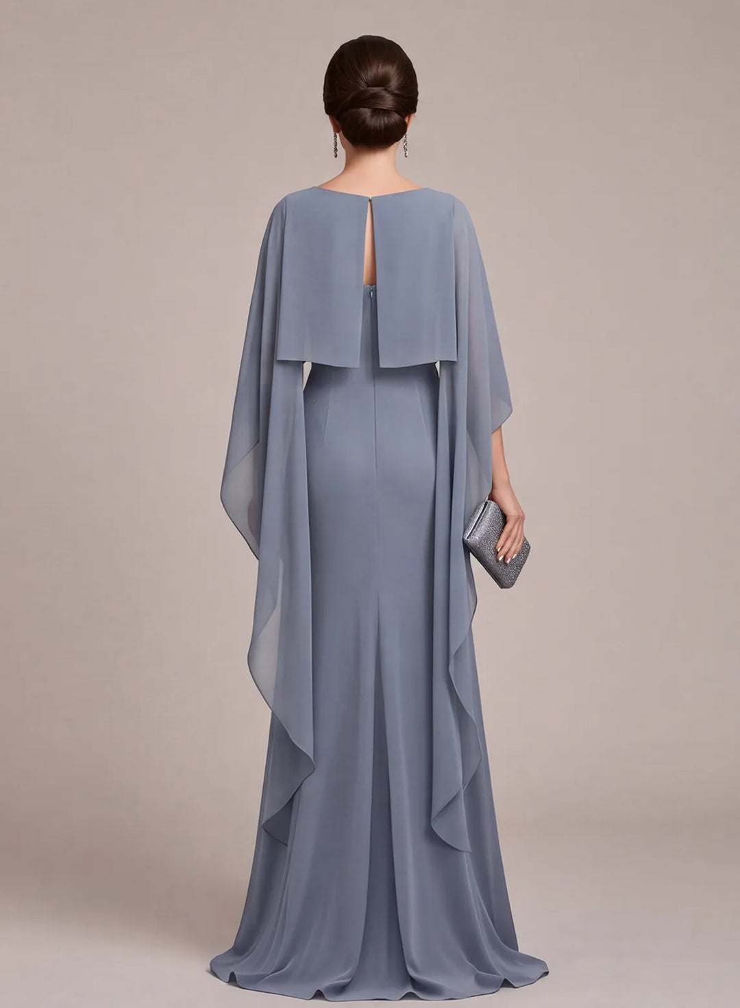 Back view of dusty blue formal gown with flowing cape sleeves for wedding