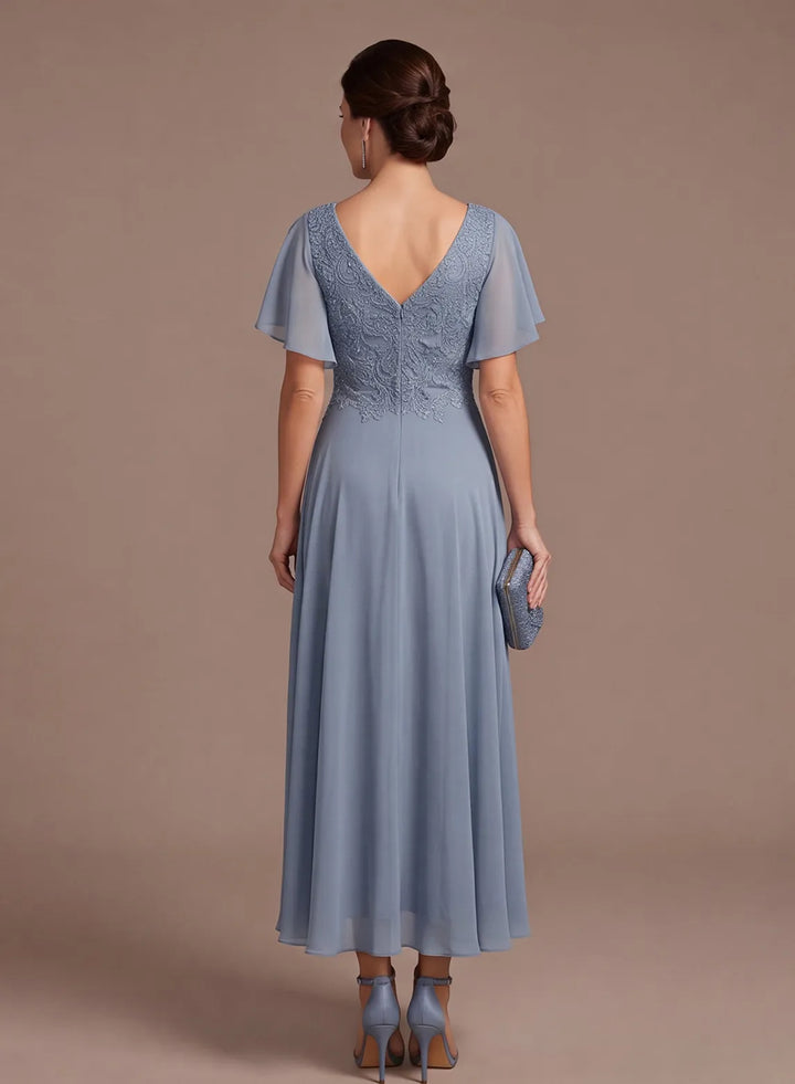 Back view of dusty blue mother of the bride dress with chiffon skirt and lace detail
