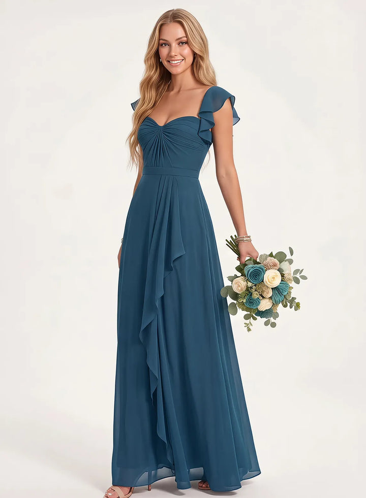 Long dusty blue chiffon bridesmaid dress with flowing skirt and feminine silhouette