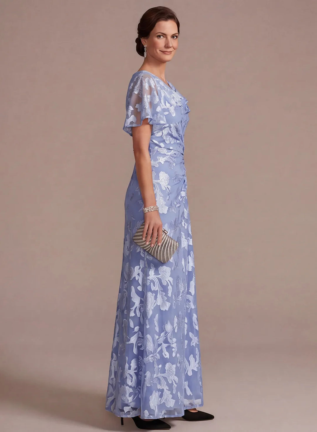 Side view of dusty blue short sleeve wedding guest dress with floral pattern