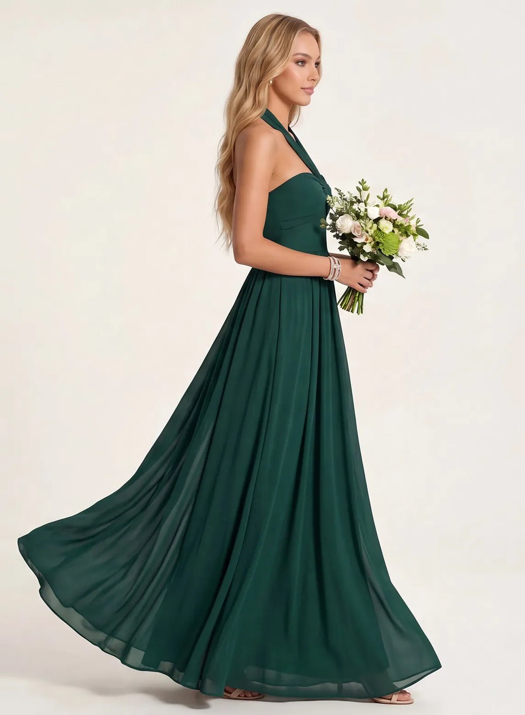 Emerald green flowy bridesmaid dress with elegant floor-length silhouette