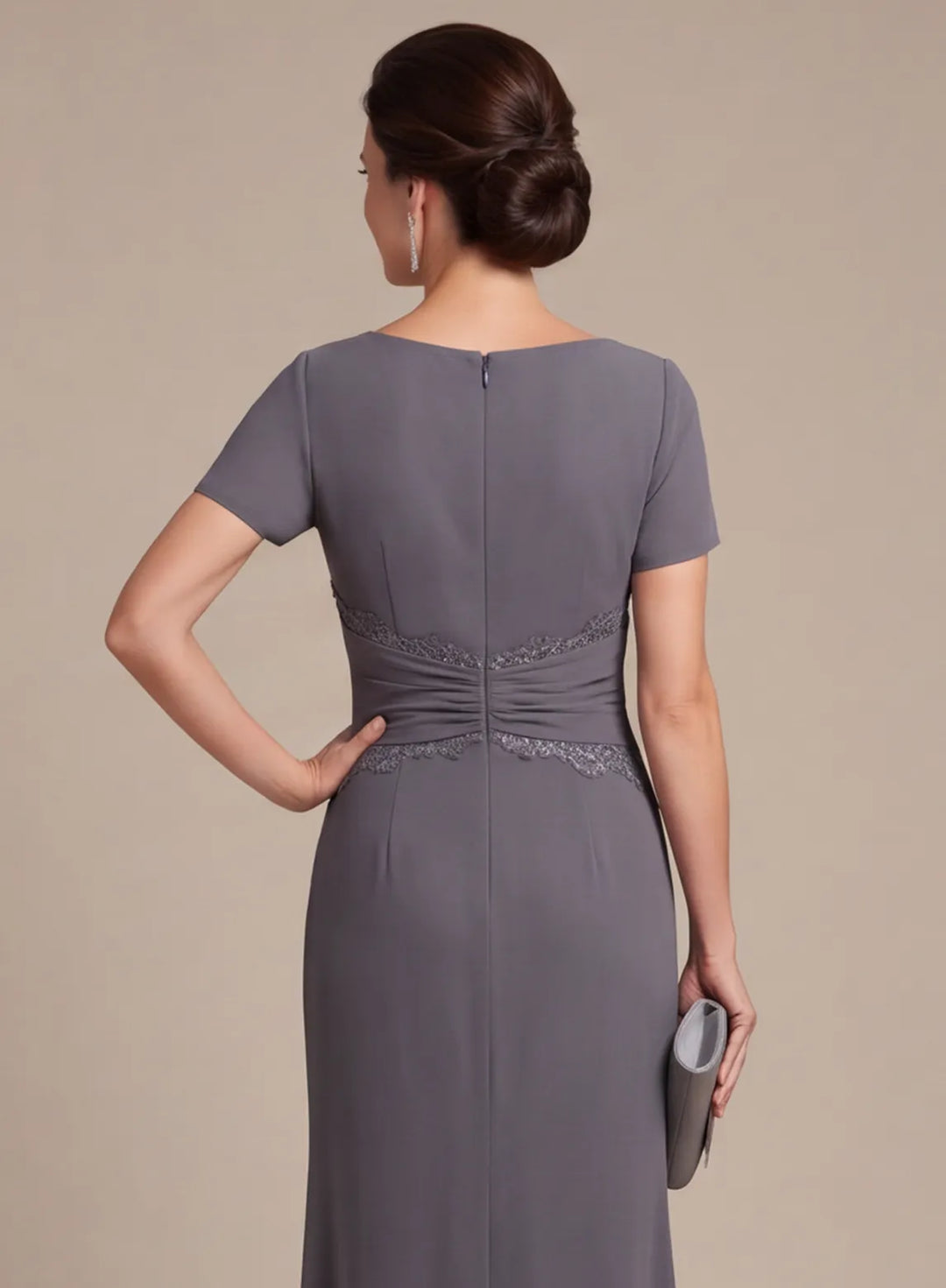 Gray formal gown back bodice with a center zipper and fitted waist