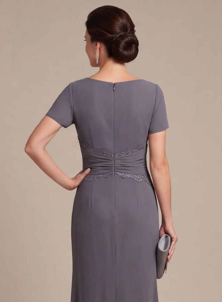 Gray formal gown back bodice with a center zipper and fitted waist