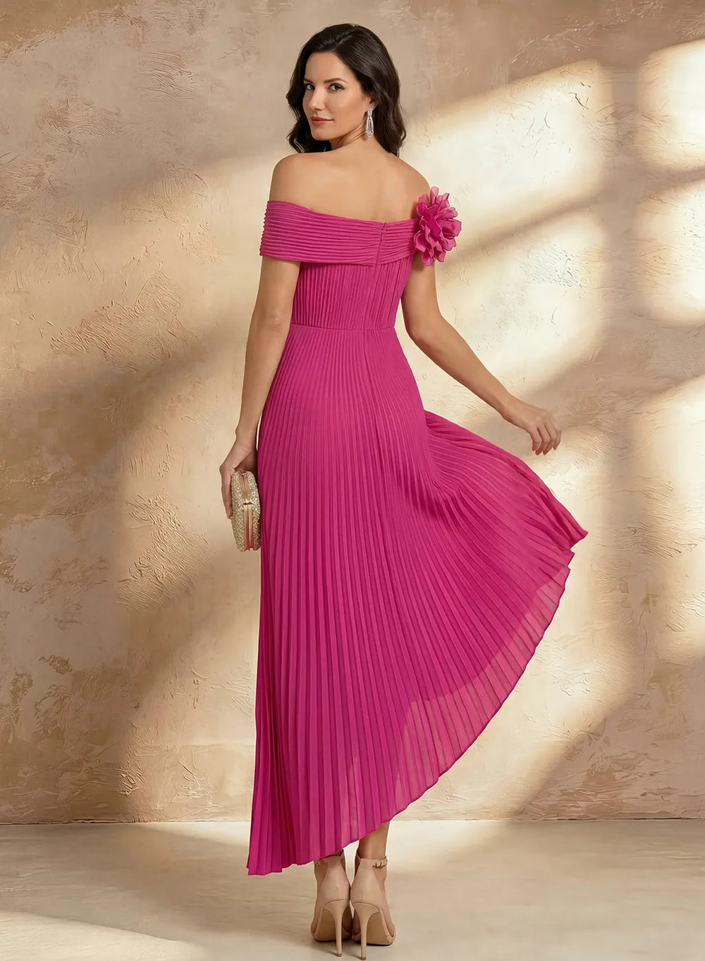 Hot pink pleated formal dress with an elegant flowing silhouette for special occasions