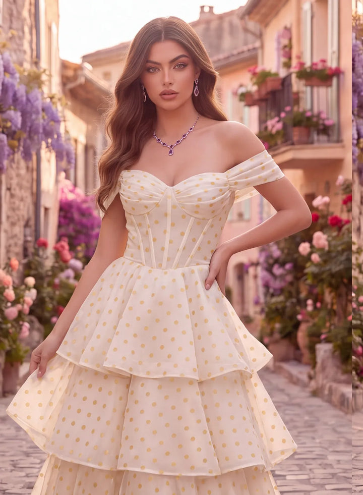 Close-up of the structured corset bodice and delicate gold polka dot detailing on an ivory prom dress.

复制 ALT