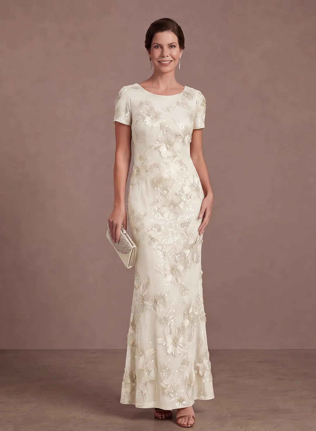 Ivory floral sequin evening gown with a classic neckline and graceful floor-length skirt