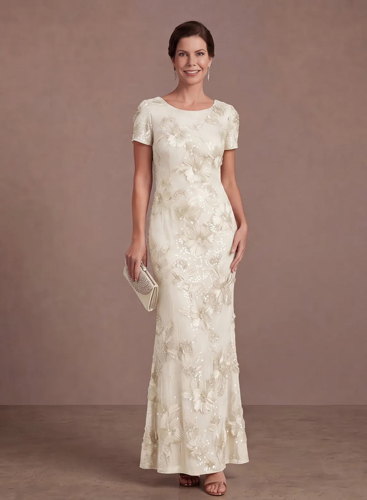 Ivory floral sequin evening gown with a classic neckline and graceful floor-length skirt