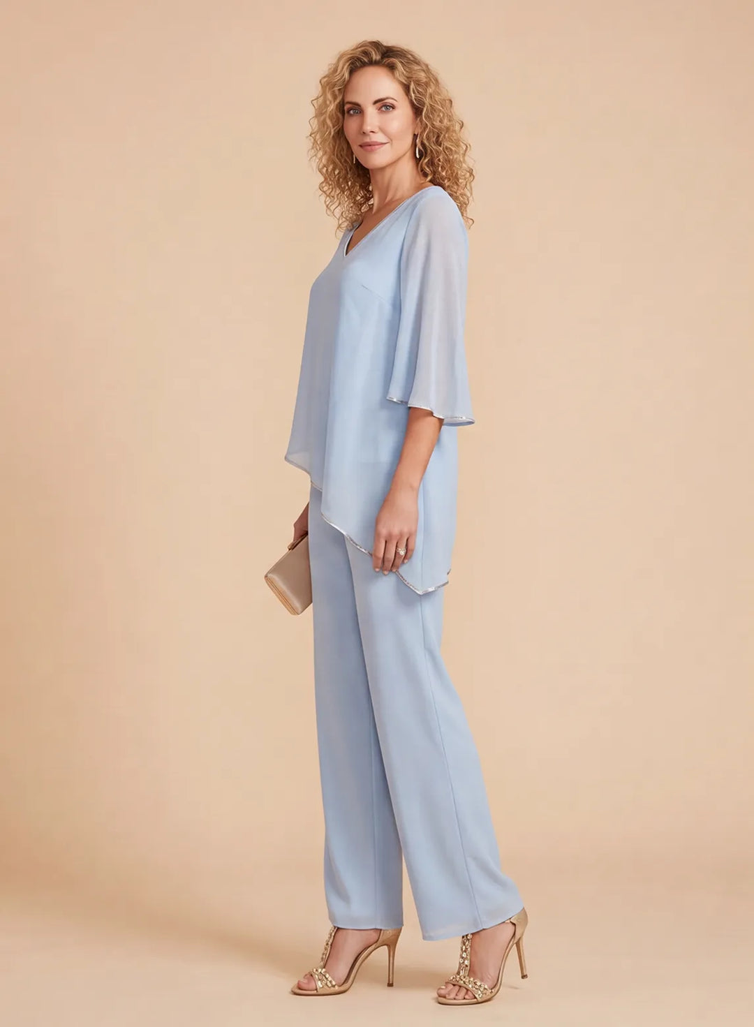 Side view of a light blue chiffon 2-piece pantsuit featuring a flowing asymmetric hem and elegant wide sleeves