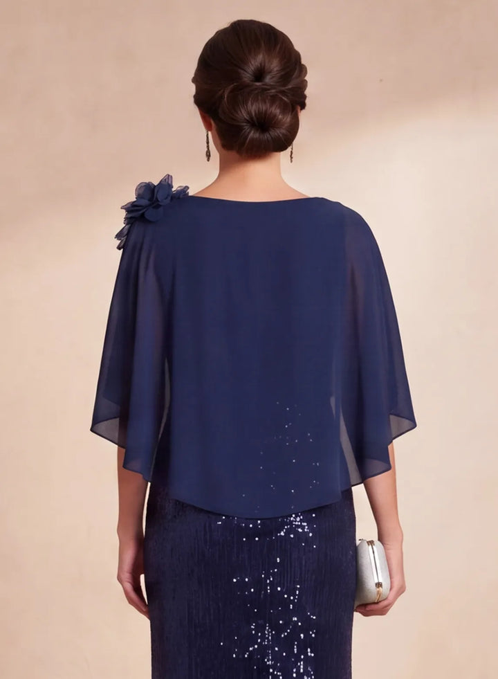 Back detail of navy blue chiffon cape overlay on sequin formal gown