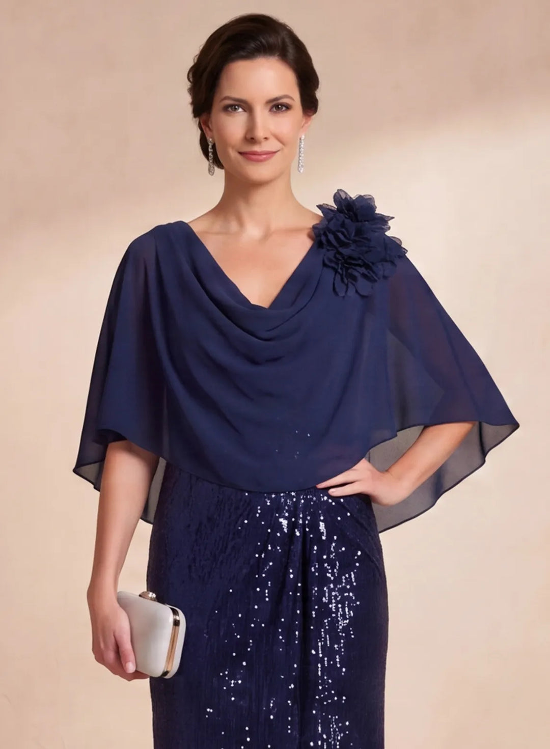 Navy blue chiffon cape with floral shoulder detail on formal gown