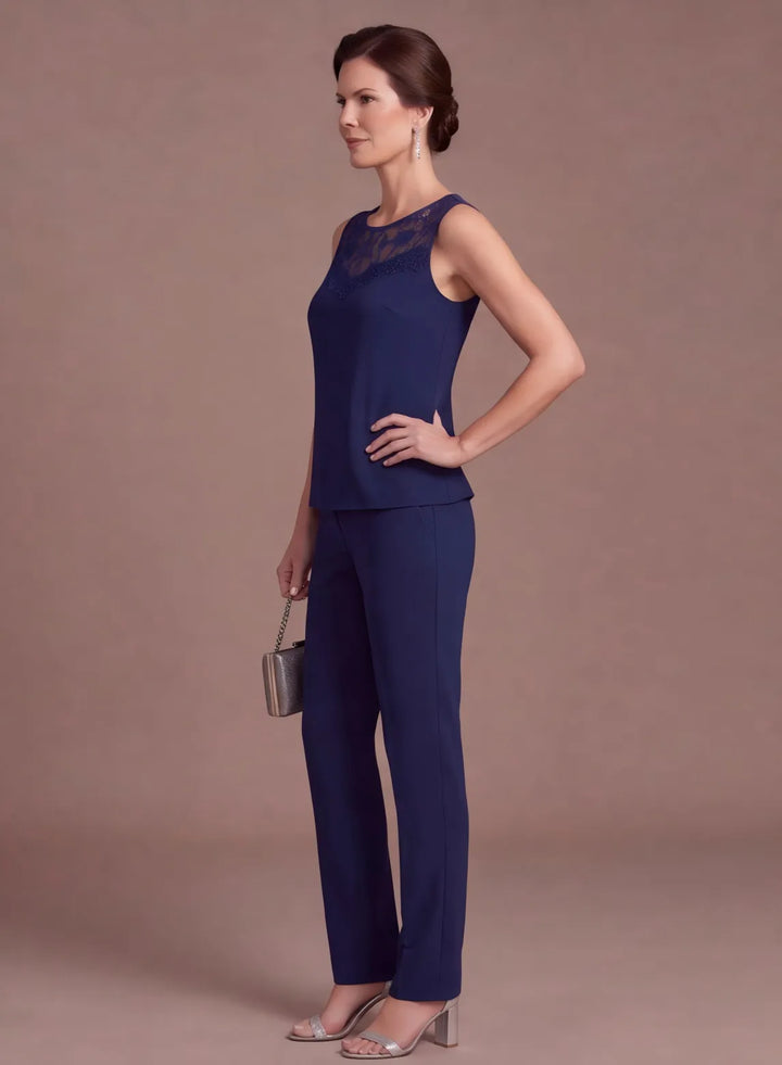Navy blue chiffon pantsuit with flowing layered top and straight-leg trousers, profile view