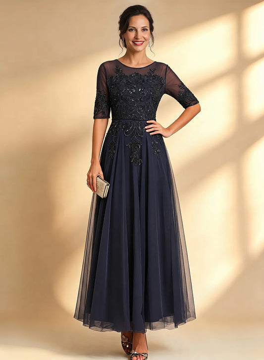 Navy blue mother of the bride gown with lace sleeves and elegant floor length silhouette
