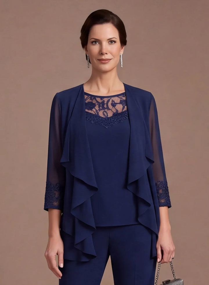 Close-up of navy blue chiffon pantsuit featuring an intricate lace neckline and layered bodice